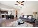 Open-concept living area flows into the kitchen and dining space, complete with hardwood floors and ample seating at 207 Cross Rd, Acworth, GA 30102