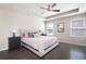 Spacious main bedroom with hardwood floors, ceiling fan, and natural light, creating a relaxing retreat at 207 Cross Rd, Acworth, GA 30102