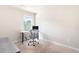 Office space with an adjustable height desk, ergonomic chair and carpet flooring at 207 Cross Rd, Acworth, GA 30102