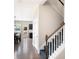 Entry staircase featuring carpeted steps, white risers and wooden banister leading to the upper level at 207 Cross Rd, Acworth, GA 30102