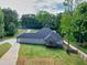 Aerial view of house with large lot, long driveways, and surrounded by green trees at 332 Mount Zion Rd, Oxford, GA 30054