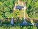 Aerial view of house with large lot, long driveways, and surrounded by green trees at 332 Mount Zion Rd, Oxford, GA 30054