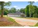 Lush backyard with a long driveway and lots of space at 332 Mount Zion Rd, Oxford, GA 30054
