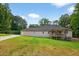 Expansive backyard with lush greenery, showcasing a charming deck and ample space for outdoor activities at 332 Mount Zion Rd, Oxford, GA 30054