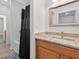 Renovated bathroom featuring granite counters, vanity, shower, and tile floors at 332 Mount Zion Rd, Oxford, GA 30054