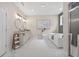 Bright bathroom showcasing a double sink vanity, soaking tub, and separate shower with marble tile at 332 Mount Zion Rd, Oxford, GA 30054