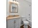 Clean bathroom with new vanity, tub, and white tile at 332 Mount Zion Rd, Oxford, GA 30054
