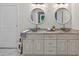 Bathroom featuring a double vanity with granite countertops and vessel sinks, and wooden cabinets at 332 Mount Zion Rd, Oxford, GA 30054