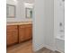 Bathroom showcasing a granite double vanity and a glass door leading to the shower and tub at 332 Mount Zion Rd, Oxford, GA 30054