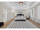 Spacious bedroom with a tray ceiling, recessed lighting, and a large window for natural light at 332 Mount Zion Rd, Oxford, GA 30054