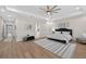 Large bedroom offering hardwood floors, ceiling fan, and easy access to the ensuite bathroom at 332 Mount Zion Rd, Oxford, GA 30054