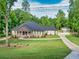 Beautiful home with brick accents, a large front porch, and a well manicured lawn at 332 Mount Zion Rd, Oxford, GA 30054