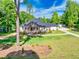 Beautiful home with brick accents, a large front porch, and a well manicured lawn at 332 Mount Zion Rd, Oxford, GA 30054