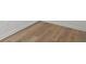 Close-up of wood-look hard floors and white base trim at 332 Mount Zion Rd, Oxford, GA 30054