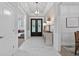 Bright foyer with stylish console table and decorative lighting, welcomes visitors to the home at 332 Mount Zion Rd, Oxford, GA 30054