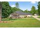 Charming single-story home with a welcoming front porch, complemented by a beautifully landscaped yard at 332 Mount Zion Rd, Oxford, GA 30054