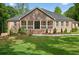 Charming brick home featuring a manicured lawn and inviting front porch, perfect for relaxing outdoors at 332 Mount Zion Rd, Oxford, GA 30054