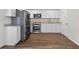 Modern kitchen boasts stainless steel appliances and bright white cabinets at 332 Mount Zion Rd, Oxford, GA 30054