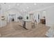 Open-concept kitchen with island seating, stainless appliances, and sleek countertops at 332 Mount Zion Rd, Oxford, GA 30054