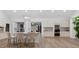 Modern kitchen features an island with seating, stainless appliances, and plenty of cabinet storage at 332 Mount Zion Rd, Oxford, GA 30054