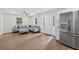 Bright open concept kitchen and living room with stainless appliances and hardwood floors at 332 Mount Zion Rd, Oxford, GA 30054
