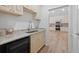 Kitchenette featuring granite countertops, custom cabinets, stainless steel sink and mini-fridge at 332 Mount Zion Rd, Oxford, GA 30054