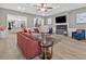 Open living room with fireplace, hardwood floors, high ceilings, and views into the gourmet kitchen at 332 Mount Zion Rd, Oxford, GA 30054