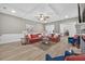 This well-lit living room boasts hardwood floors, ceiling fan, fireplace and easy access to the dining area at 332 Mount Zion Rd, Oxford, GA 30054