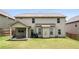 Well-maintained backyard with covered patio, green lawn, and mature landscaping, perfect for outdoor activities at 6213 Old Kingston Dr, Atlanta, GA 30331