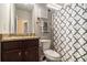 Well-lit bathroom features granite countertop, decorative shower curtain, and neutral color scheme at 6213 Old Kingston Dr, Atlanta, GA 30331