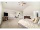 Large bedroom with vaulted ceilings, a television, and carpet flooring, offering a cozy retreat at 6213 Old Kingston Dr, Atlanta, GA 30331