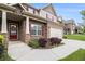 Inviting home with a brick and siding exterior, red shutters, and a landscaped front yard leading to the entrance at 6213 Old Kingston Dr, Atlanta, GA 30331