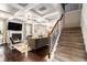 Elegant living room with coffered ceilings, hardwood floors, a fireplace, and stylish furnishings at 6213 Old Kingston Dr, Atlanta, GA 30331