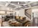 Spacious living room with hardwood floors, coffered ceilings, a staircase, and an open layout to the kitchen at 6213 Old Kingston Dr, Atlanta, GA 30331
