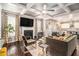 Stunning living room featuring a fireplace, hardwood floors, decorative curtains, and modern decor at 6213 Old Kingston Dr, Atlanta, GA 30331