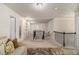Loft area with carpeting, railing overlooking the stairs, and neutral wall paint, creating a cozy space at 6213 Old Kingston Dr, Atlanta, GA 30331