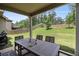 Outdoor patio featuring a dining table with backyard views and privacy fence at 6213 Old Kingston Dr, Atlanta, GA 30331