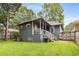 Exterior home shot highlights the outdoor grill and the spacious backyard at 1148 Ne Hardee Ne St, Atlanta, GA 30307
