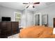 Comfortable bedroom has neutral paint, dark floors, and ample dresser storage at 1148 Ne Hardee Ne St, Atlanta, GA 30307