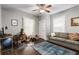 Charming bedroom featuring hardwood floors, a ceiling fan, a sitting area, and plenty of natural light at 1148 Ne Hardee Ne St, Atlanta, GA 30307