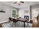 Dining room features a modern table and chairs with an area rug, hardwood floors, and a fireplace at 1148 Ne Hardee Ne St, Atlanta, GA 30307