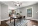 Inviting dining room showcasing a modern table and chairs with an adjoining kitchen and hardwood floors at 1148 Ne Hardee Ne St, Atlanta, GA 30307