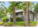 Charming home with a cozy front porch nestled amongst mature trees and lush greenery at 1148 Ne Hardee Ne St, Atlanta, GA 30307