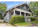 Charming home featuring a covered front porch, complemented by landscaped greenery and inviting curb appeal at 1148 Ne Hardee Ne St, Atlanta, GA 30307