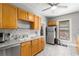Bright kitchen with wood cabinets, stainless steel appliances, ample counter space, and tile flooring at 1148 Ne Hardee Ne St, Atlanta, GA 30307