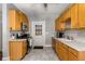 Kitchen features wood cabinets, modern appliances, a ceiling fan, tile floors, and plenty of natural light at 1148 Ne Hardee Ne St, Atlanta, GA 30307
