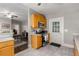 Kitchen showcases wood cabinets, modern appliances, tile floors, and an adjacent dining room at 1148 Ne Hardee Ne St, Atlanta, GA 30307