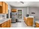 Kitchen area features wood cabinets, stainless steel appliances, tile floors, and ample counter space at 1148 Ne Hardee Ne St, Atlanta, GA 30307
