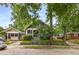 View of the home showing the facade and landscaping, blending seamlessly into its tree-lined street at 1148 Ne Hardee Ne St, Atlanta, GA 30307