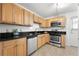 Well-lit kitchen boasts stainless steel appliances, subway tile backsplash, and granite countertops at 1355 Euclid Ne Ave # A8, Atlanta, GA 30307